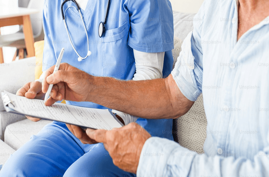 patient signing document with doctor